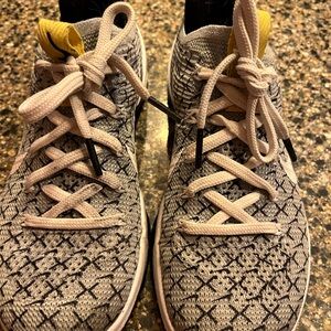 Stylish Nike Grey Patterned Sneakers with Yellow Accents